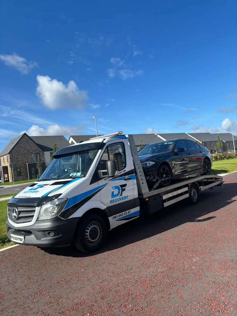 Car transport with DF Recovery's branded Mercedes flatbed