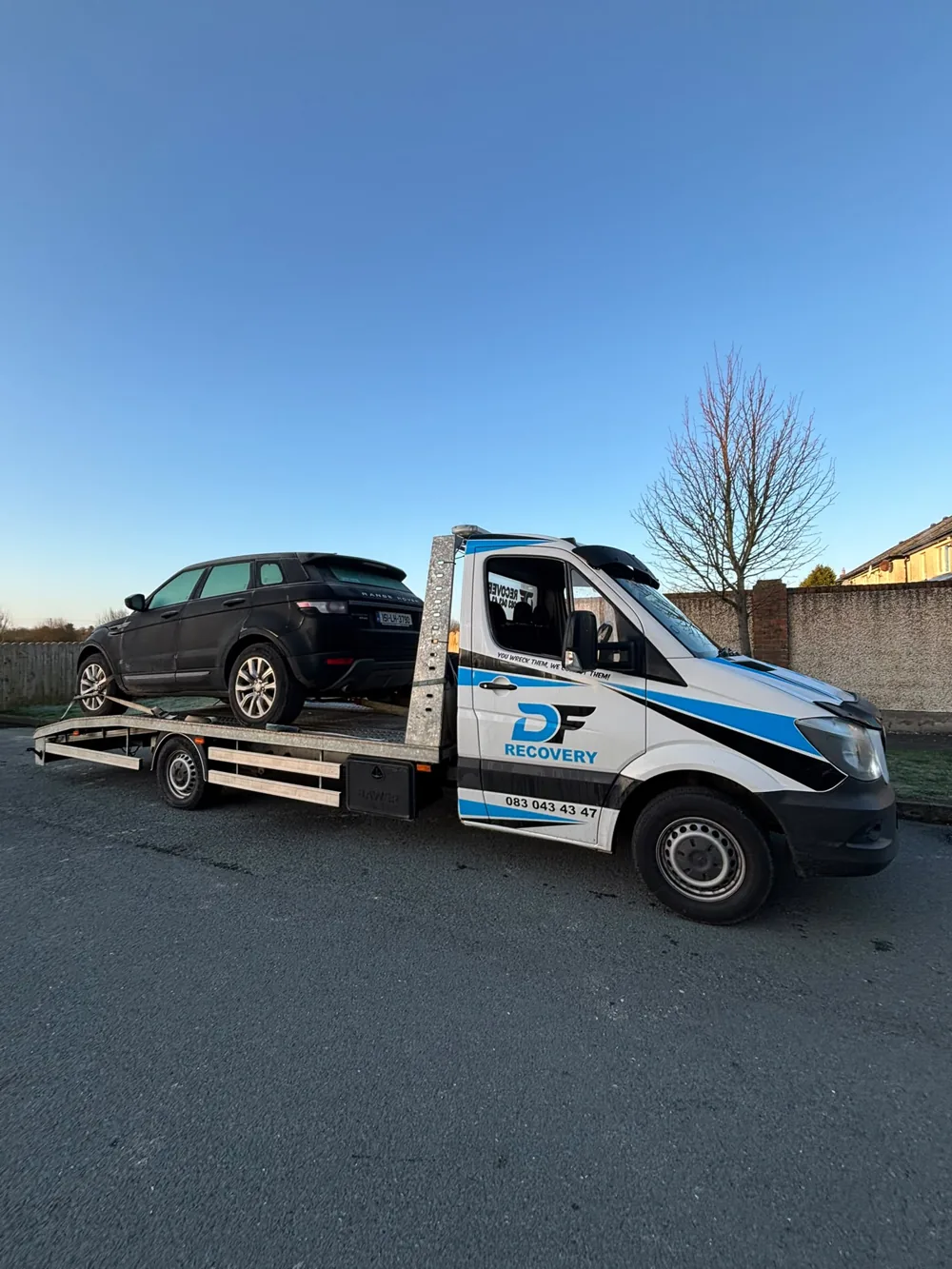 SUV transport with DF Recovery's branded Mercedes flatbed