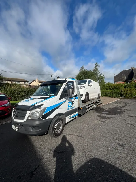 DF Recovery white and blue flatbed on a vehicle collection