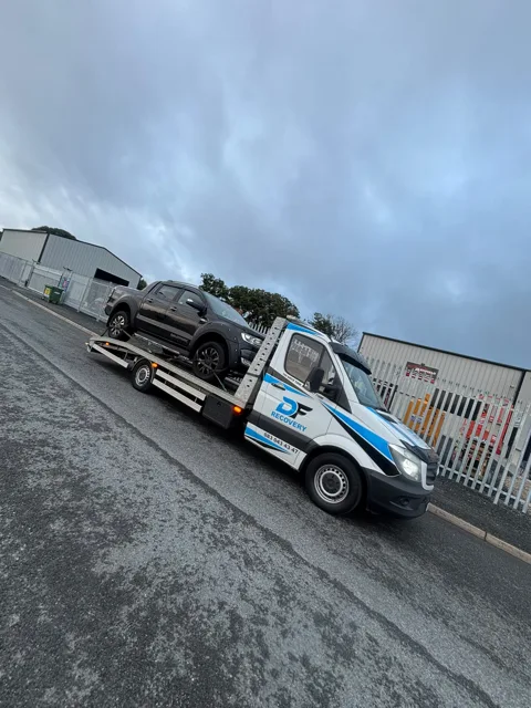 DF Recovery white and blue flatbed on a vehicle collection