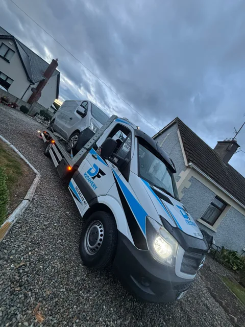 DF Recovery white and blue flatbed on a vehicle collection