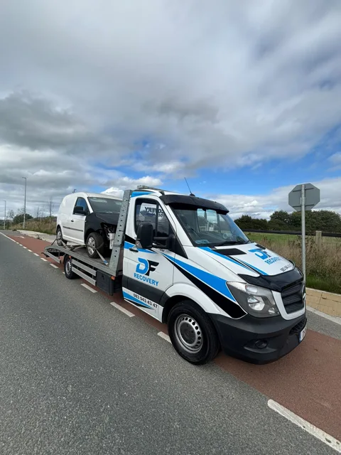 DF Recovery white and blue flatbed on a vehicle collection