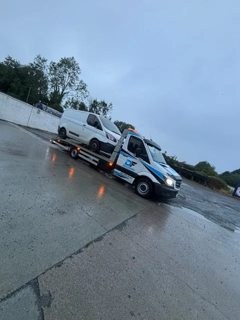 DF Recovery white and blue flatbed on a vehicle collection