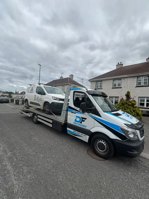 DF Recovery white and blue flatbed on a vehicle collection